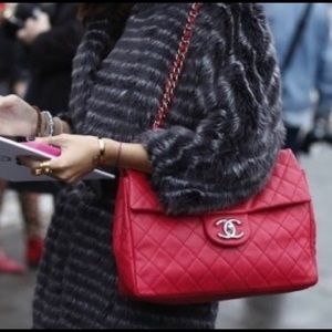 Chanel soft caviar maxi red pushia color bag.